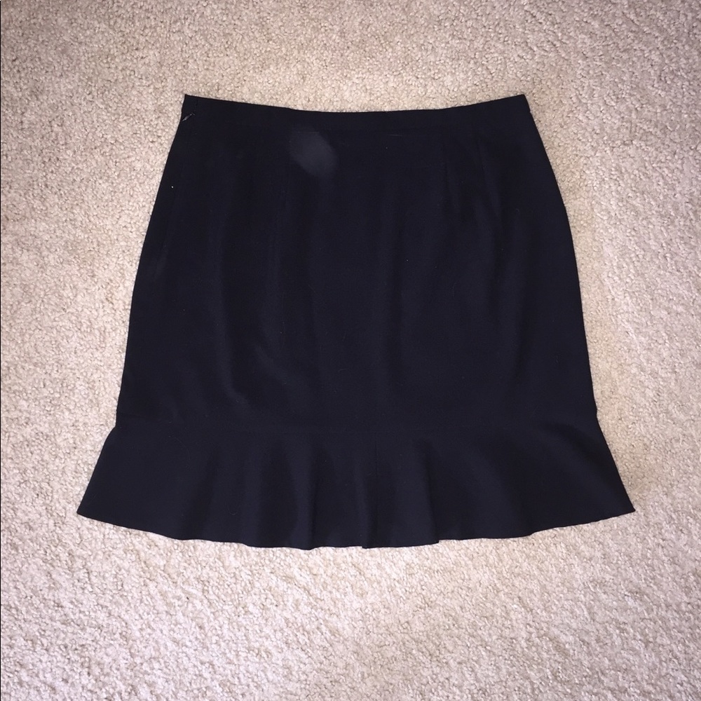 Black over the knee skirt w/ ruffle flare bottom.